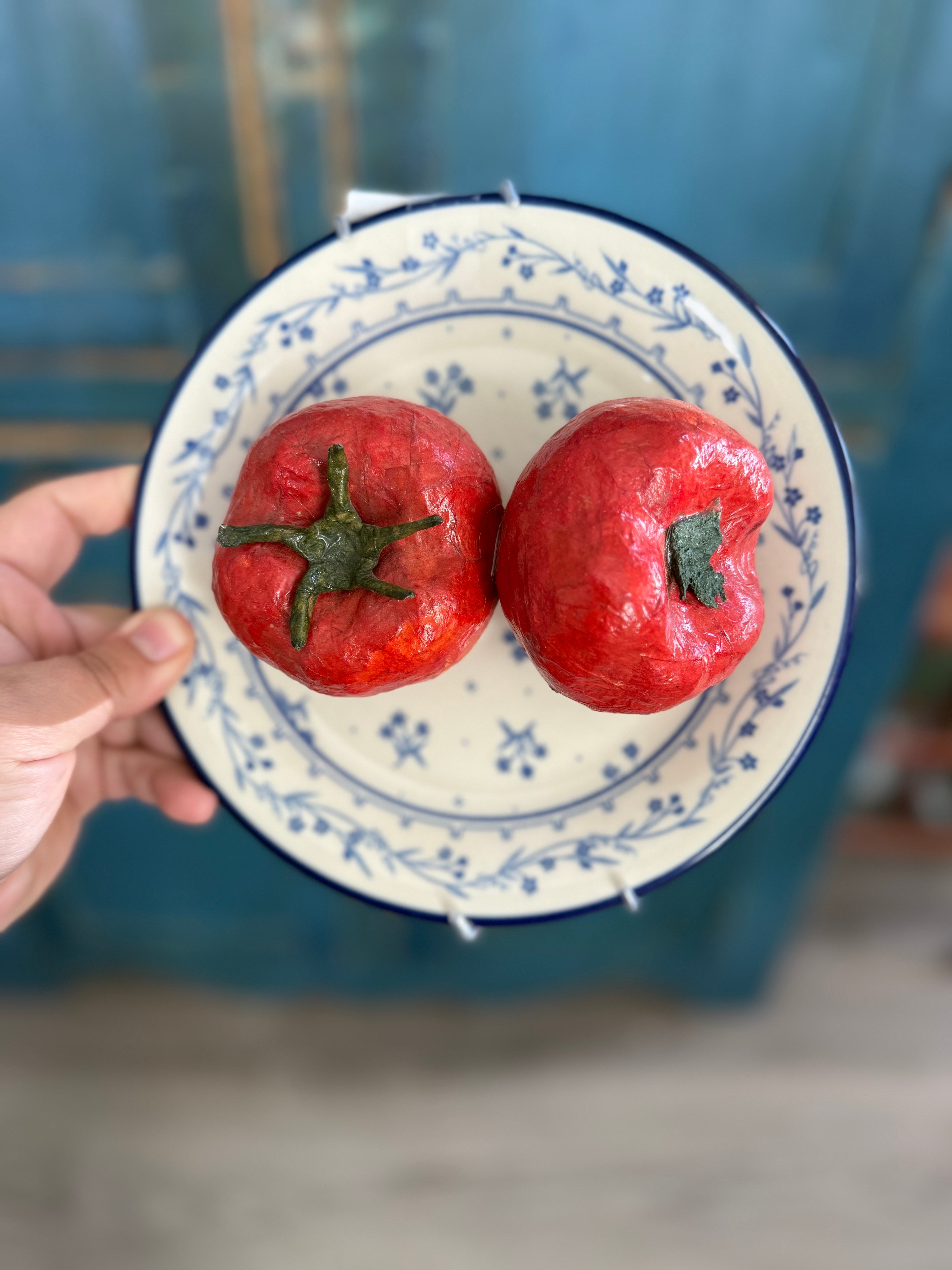 Vintage paper mache tomatoes on a vintage plate